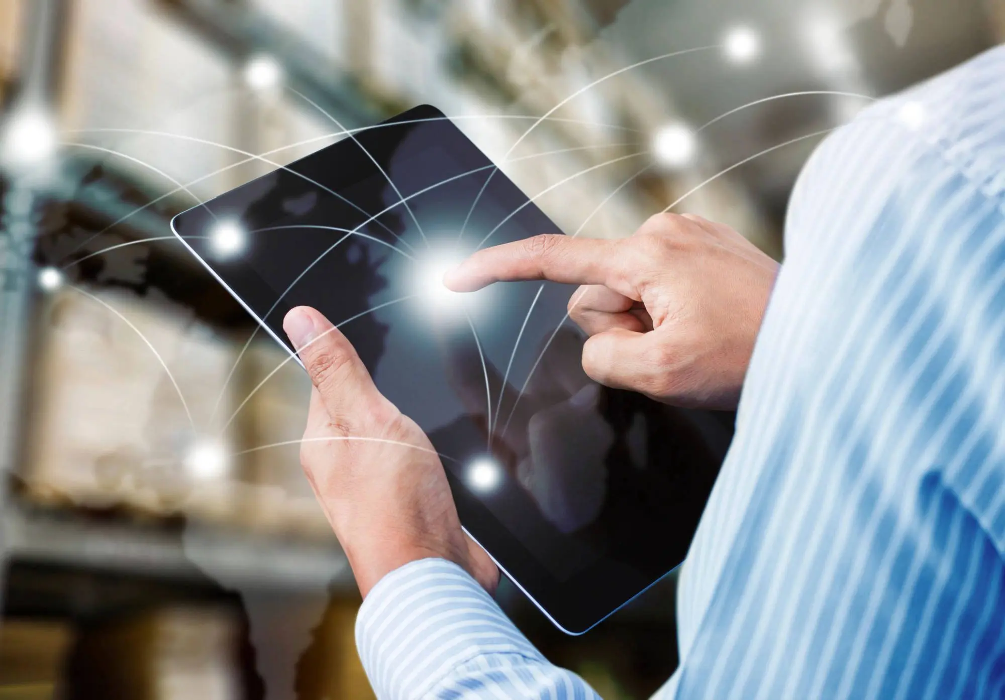 Hand interacting with digital interface on tablet