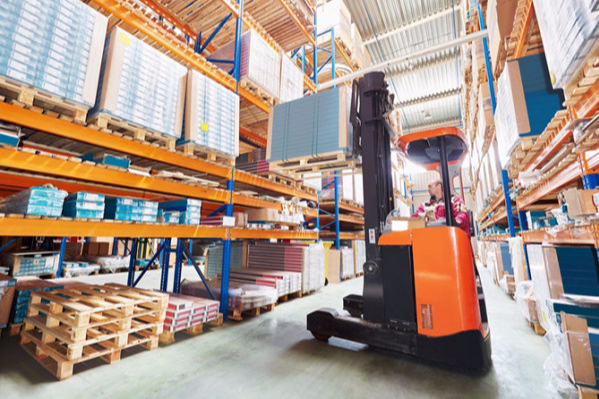 Forklift operating in a warehouse