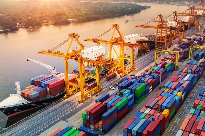 Shipping containers stacked at harbor