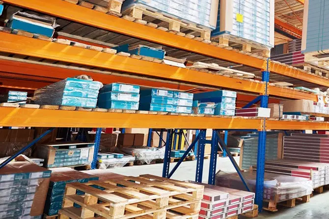Warehouse shelves with stacked pallets